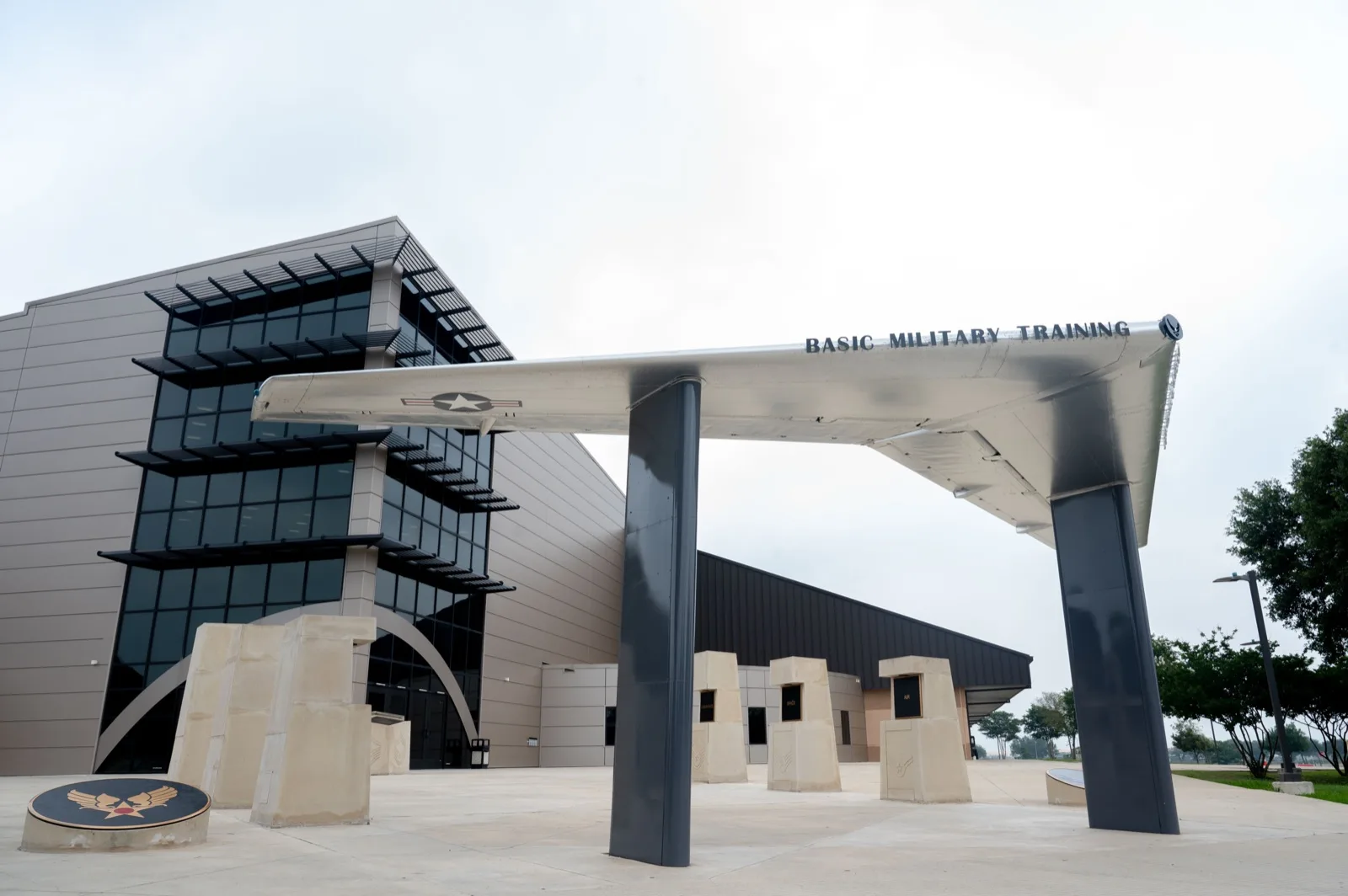 Pfingston Reception Center entrance at JBSA-Lackland, with the Basic Military Training wing canopy